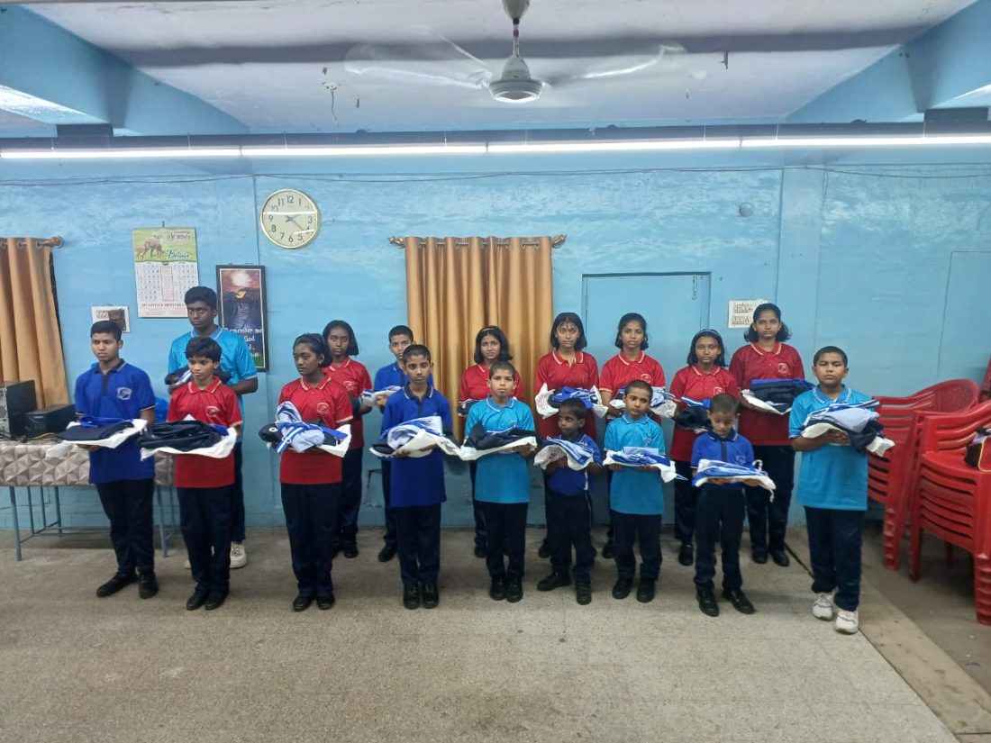 Schoolchildren receiving uniforms